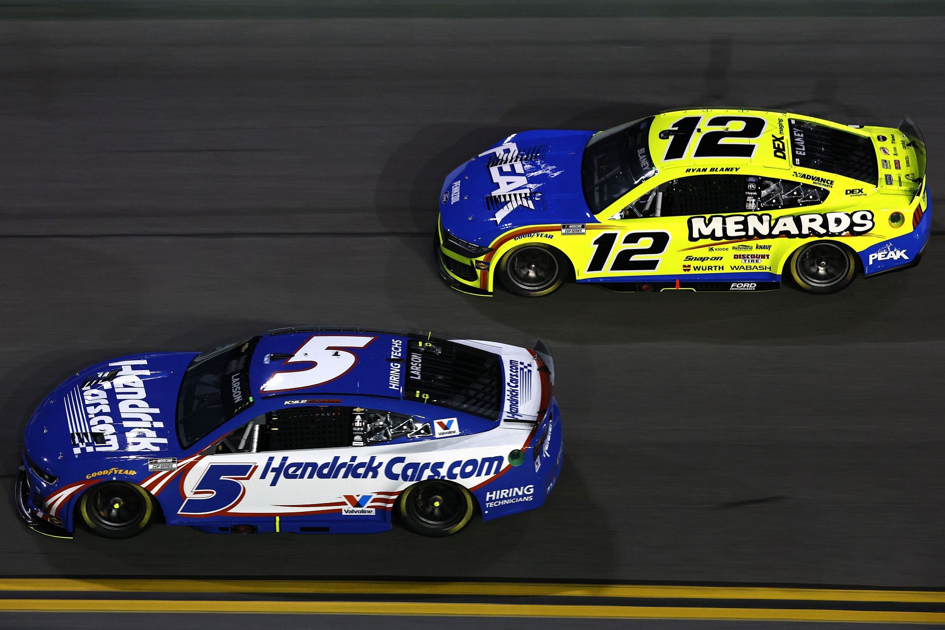 Ryan Blaney (#12) and Kyle Larson (#5) at Daytona International Speedway last February - Source: Getty